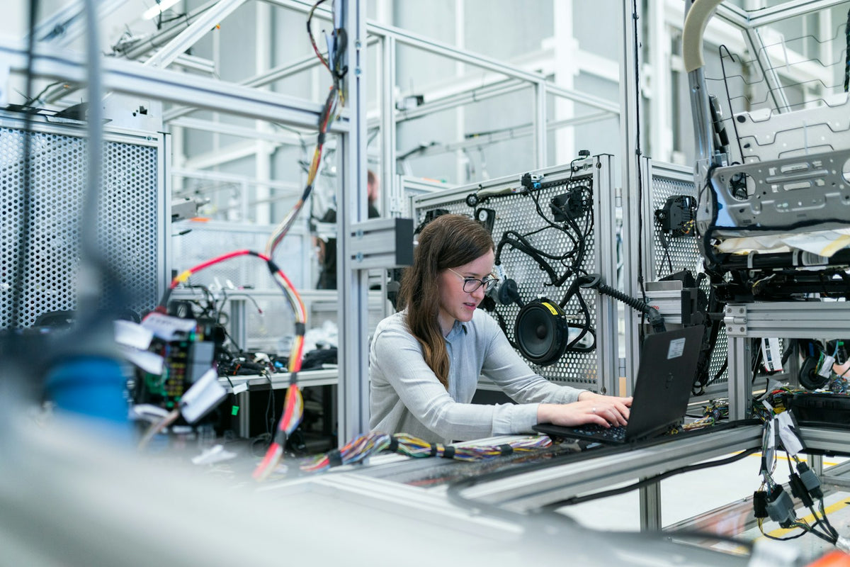 Modern industrial manufacturing line representing semiconductor production